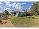 The backyard of this waterfront home showcases meticulous landscaping and a quaint gazebo overlooking the serene canal at 2012 River Basin Ter, Punta Gorda, FL 33982