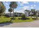 Beautifully landscaped single-Gathering home with well-maintained lawn and a metal roof at 2012 River Basin Ter, Punta Gorda, FL 33982