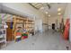 The expansive garage includes organized shelving and a clear layout, providing space for parking and storage solutions at 2012 River Basin Ter, Punta Gorda, FL 33982