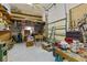 This workshop area features extensive shelving and workbenches, perfect for hobbies and projects in an organized setting at 2012 River Basin Ter, Punta Gorda, FL 33982