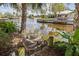 This water view showcases a lush canal setting, complete with private docks, tropical foliage, and inviting water features at 2012 River Basin Ter, Punta Gorda, FL 33982