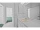 Bright bathroom featuring a single vanity sink and mirror with recessed lighting at 3487 Cabaret St, Port Charlotte, FL 33948
