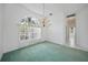Dining area with natural light, chandelier, and neutral flooring at 3487 Cabaret St, Port Charlotte, FL 33948