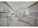 Clean kitchen features lots of counter space and neutral flooring at 3487 Cabaret St, Port Charlotte, FL 33948