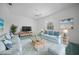 Bright living room with coastal decor, comfortable seating, and a serene, inviting atmosphere at 3487 Cabaret St, Port Charlotte, FL 33948