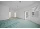 Spacious primary bedroom with ensuite bathroom, ceiling fan, and an outdoor patio entrance at 3487 Cabaret St, Port Charlotte, FL 33948