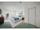 Staged primary bedroom with ensuite bathroom, ceiling fan, and bright natural lighting at 3487 Cabaret St, Port Charlotte, FL 33948