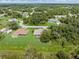 An aerial view showing the home's location in a serene, wooded neighborhood at 5366 Dunsmuir Rd, North Port, FL 34288
