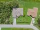 An aerial view of the home with its neatly maintained lawn and driveway at 5366 Dunsmuir Rd, North Port, FL 34288