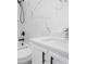 Bathroom features a stylish vanity, modern faucet, and elegant marble-style wall tiles at 5366 Dunsmuir Rd, North Port, FL 34288