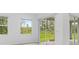 Bright living room with large windows and sliding glass doors at 5366 Dunsmuir Rd, North Port, FL 34288