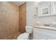 Bathroom with tiled shower and white vanity at 556 Lowell Nw Ave, Port Charlotte, FL 33952