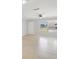 Bright living room with tile floors, neutral walls, a ceiling fan and natural light from the window at 556 Lowell Nw Ave, Port Charlotte, FL 33952