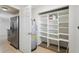 A well-organized pantry with shelving located next to a refrigerator at 556 Lowell Nw Ave, Port Charlotte, FL 33952