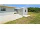 Exterior view of the shed and side of the house at 556 Lowell Nw Ave, Port Charlotte, FL 33952