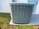 Exterior view of a gray Trane XR13 air conditioning unit set on concrete slab at 6170 David Blvd, Port Charlotte, FL 33981