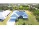 Charming single-story home featuring a well-manicured lawn, mature landscaping and attached two car garage at 6170 David Blvd, Port Charlotte, FL 33981