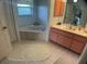 Bathroom featuring a jacuzzi tub and a single vanity at 6170 David Blvd, Port Charlotte, FL 33981
