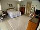 Spacious bedroom with a rocking chair and large dresser at 6170 David Blvd, Port Charlotte, FL 33981