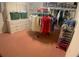 Walk-in closet with ample storage, organization system, and a full display of clothing at 6170 David Blvd, Port Charlotte, FL 33981
