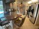 Open kitchen with stainless steel appliances, breakfast bar, and easy access to the dining area at 6170 David Blvd, Port Charlotte, FL 33981