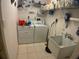 Functional laundry room with a washer, dryer, sink, and storage space for convenience at 6170 David Blvd, Port Charlotte, FL 33981