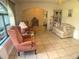 Inviting living room featuring tile flooring, neutral paint, and comfortable seating at 6170 David Blvd, Port Charlotte, FL 33981