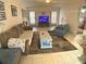 Comfortable living room features tile flooring and neutral paint for a bright and airy feel at 6170 David Blvd, Port Charlotte, FL 33981