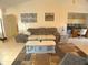 Cozy living room with tile floors, a comfortable sofa, and a decorative coffee table at 6170 David Blvd, Port Charlotte, FL 33981