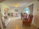 Cozy living room featuring tile flooring, neutral paint, and a large window at 6170 David Blvd, Port Charlotte, FL 33981