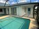 Outdoor pool featuring a patio and a ladder for easy access to the water at 6170 David Blvd, Port Charlotte, FL 33981