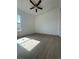 Bright bedroom with a ceiling fan, and a large window for natural light at 6219 Sweden Blvd, Punta Gorda, FL 33982