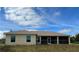 New home exterior with a covered lanai and pristine lawn, offers a serene outdoor living space at 6219 Sweden Blvd, Punta Gorda, FL 33982
