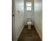 Small powder room with a simple toilet and a window allowing for natural light at 6219 Sweden Blvd, Punta Gorda, FL 33982