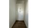 Storage area with white built in cabinets and wood-look tile floors at 6219 Sweden Blvd, Punta Gorda, FL 33982