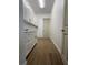 This laundry room has tile floors, a sink, storage, cabinets, and a door to the home's interior at 6372 Grove Blvd, Punta Gorda, FL 33982