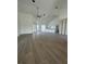 Spacious living room with vaulted ceilings, recessed lighting, fan, wood-look flooring, and an open layout at 6372 Grove Blvd, Punta Gorda, FL 33982