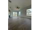 Inviting living room featuring light-colored walls, wood-look floors, recessed lighting, and large sliding doors at 6372 Grove Blvd, Punta Gorda, FL 33982