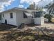 Rear view of the house showing the AC unit at 710 Aqui Esta Dr, Punta Gorda, FL 33950