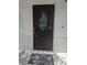Elegant front door with decorative glass, enhancing the curb appeal of this charming single-Gathering home at 710 Aqui Esta Dr, Punta Gorda, FL 33950
