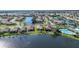 Aerial view of the home with lake frontage in a beautiful neighborhood at 7346 Talon Bay Dr, North Port, FL 34287