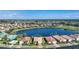 An aerial view showcases the single-Gathering home's lakefront location and desirable neighborhood at 7346 Talon Bay Dr, North Port, FL 34287