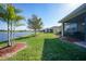 Enjoy serene lake views from the beautifully landscaped backyard and screened lanai at 7346 Talon Bay Dr, North Port, FL 34287