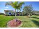 Beautiful backyard with lush landscaping and serene lake views at 7346 Talon Bay Dr, North Port, FL 34287