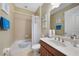 Cozy bathroom with tub, shower and single sink vanity at 7346 Talon Bay Dr, North Port, FL 34287