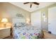Comfortable bedroom featuring ceiling fan, closet, coastal-themed decorations and night stand at 7346 Talon Bay Dr, North Port, FL 34287
