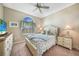 Cozy bedroom with large window, dresser, nightstand and coastal decor at 7346 Talon Bay Dr, North Port, FL 34287