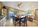 Dining area near the kitchen with sliding glass doors, with lovely views of the outdoors at 7346 Talon Bay Dr, North Port, FL 34287