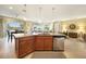 Open kitchen featuring granite countertops, stainless appliances and a large island with seating, perfect for entertaining at 7346 Talon Bay Dr, North Port, FL 34287