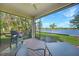 Enjoy outdoor living on this screened patio with a BBQ and beautiful lake views at 7346 Talon Bay Dr, North Port, FL 34287